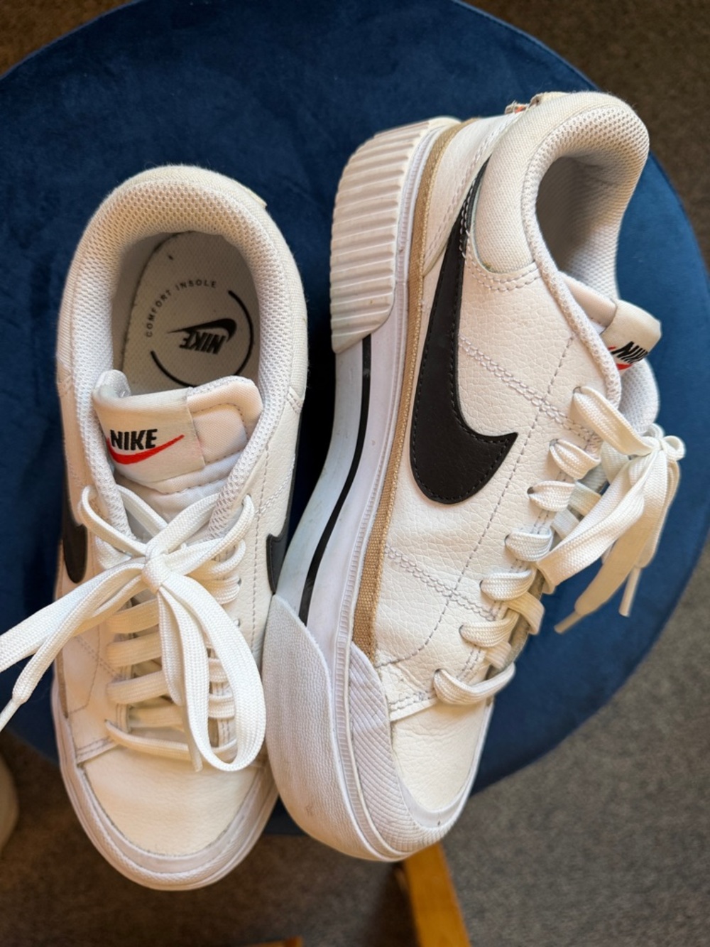 Nike White Low-Top Sneakers with Black Swoosh and Red Accent
